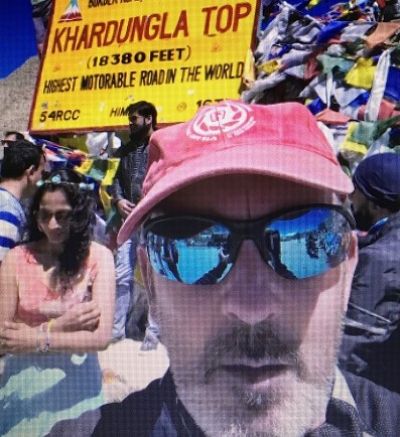 Reggie Johnston Cycling on the  tour with redspokes